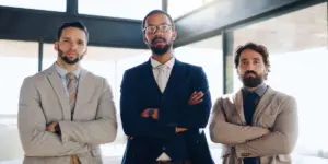 3 men standing in suits
