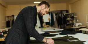 man customizing shirt