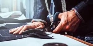 tailor using scissors
